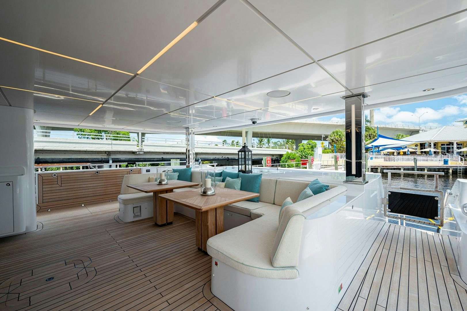 a room with a table and chairs aboard LIRA Yacht for Sale