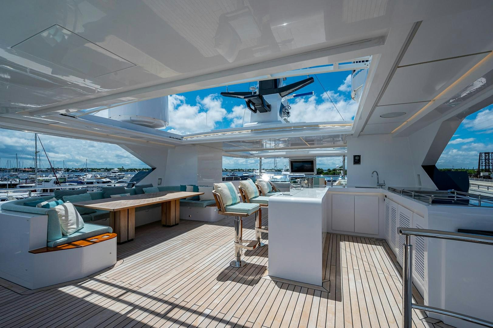 a room with a table and chairs aboard LIRA Yacht for Sale