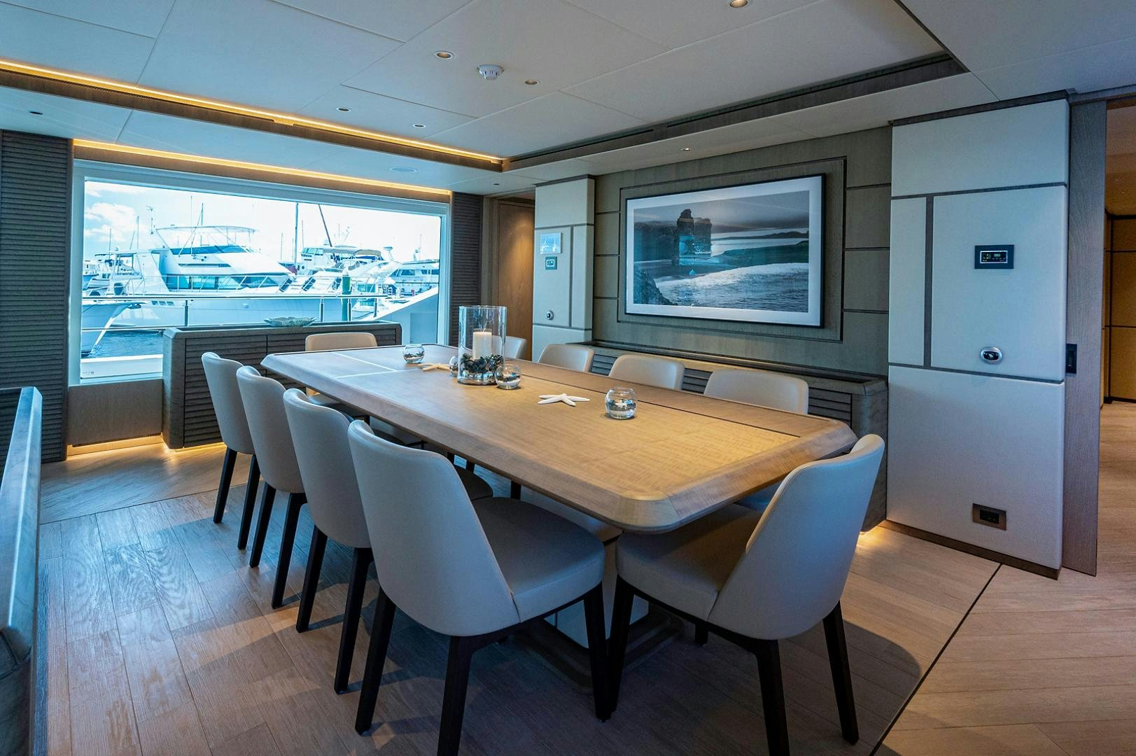 a table with chairs around it aboard LIRA Yacht for Sale