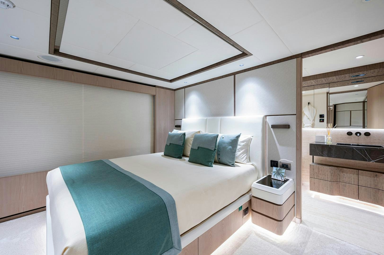a bed in a room aboard LIRA Yacht for Sale