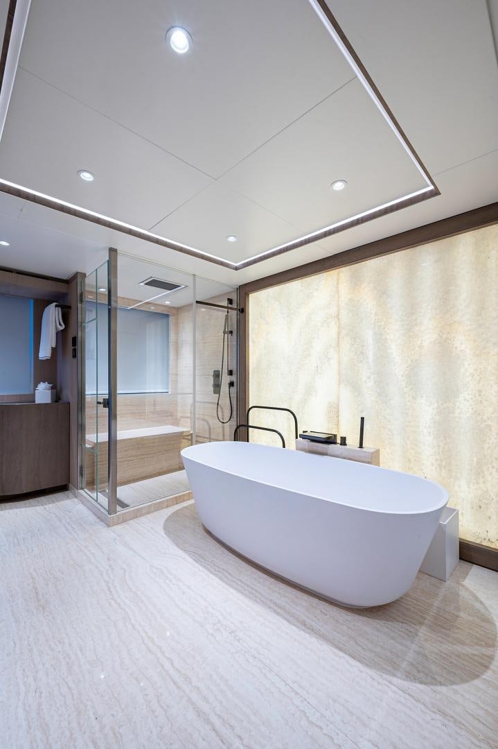 a bathroom with a tub aboard LIRA Yacht for Sale