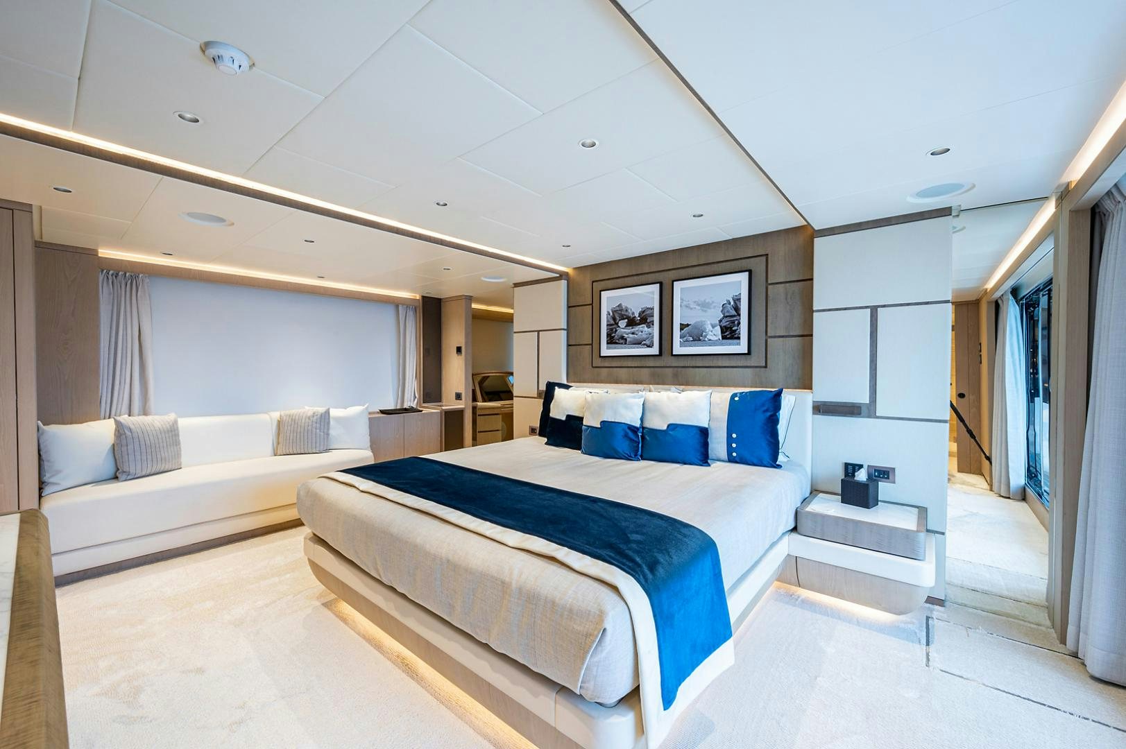 a room with a bed and a couch aboard LIRA Yacht for Sale