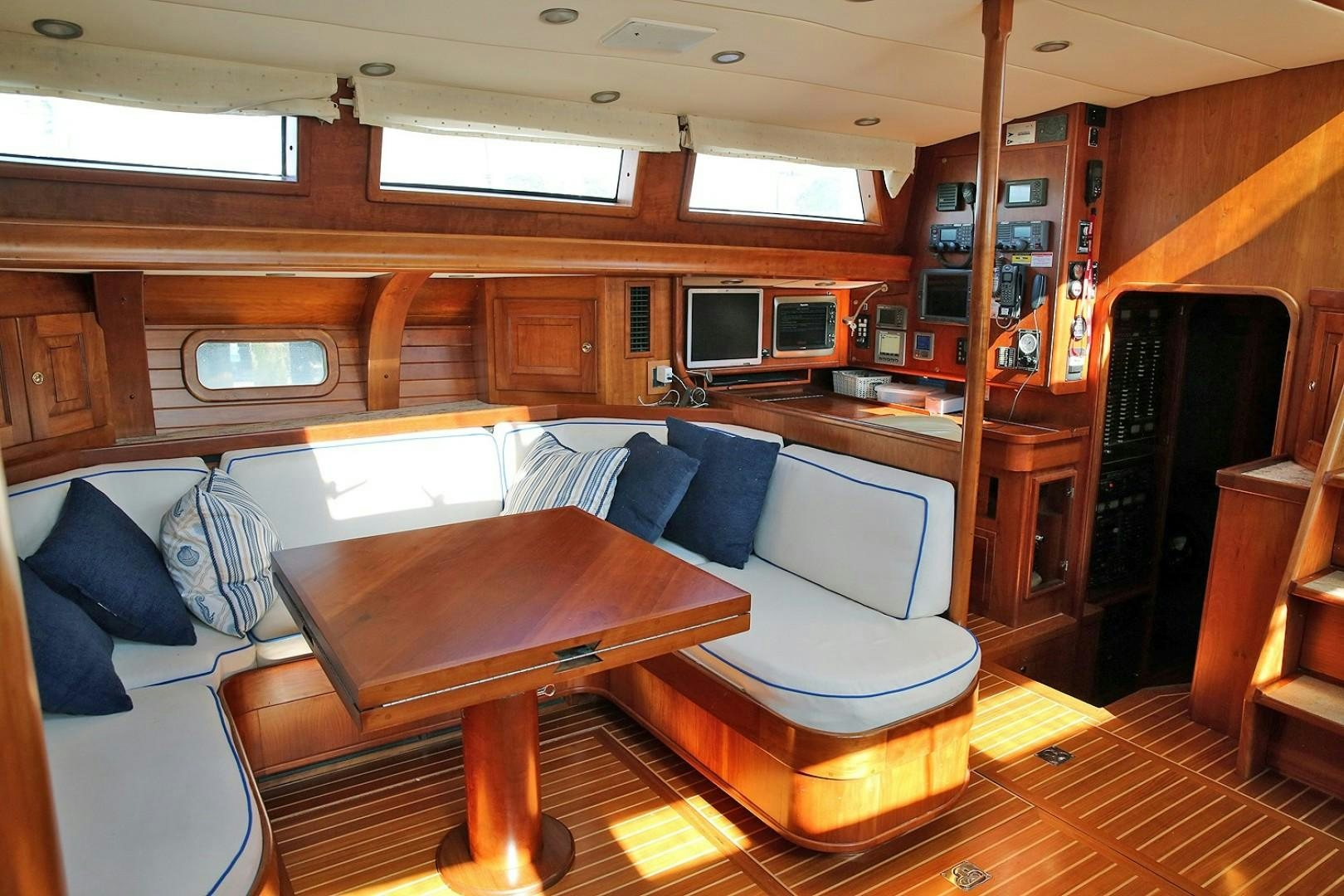 a living room with a couch and a tv aboard DANCIN BARE V Yacht for Sale