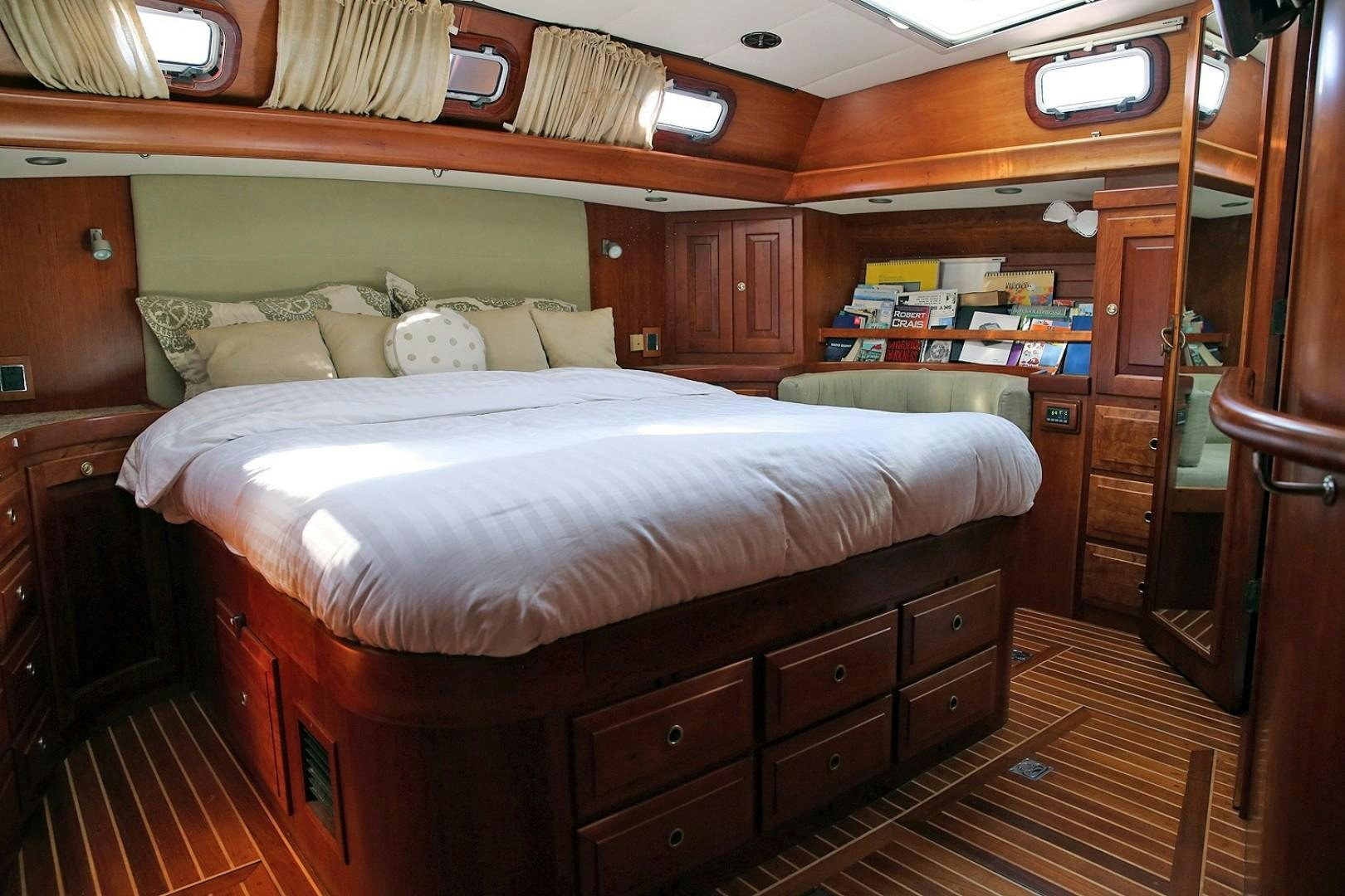 a bed in a room aboard DANCIN BARE V Yacht for Sale