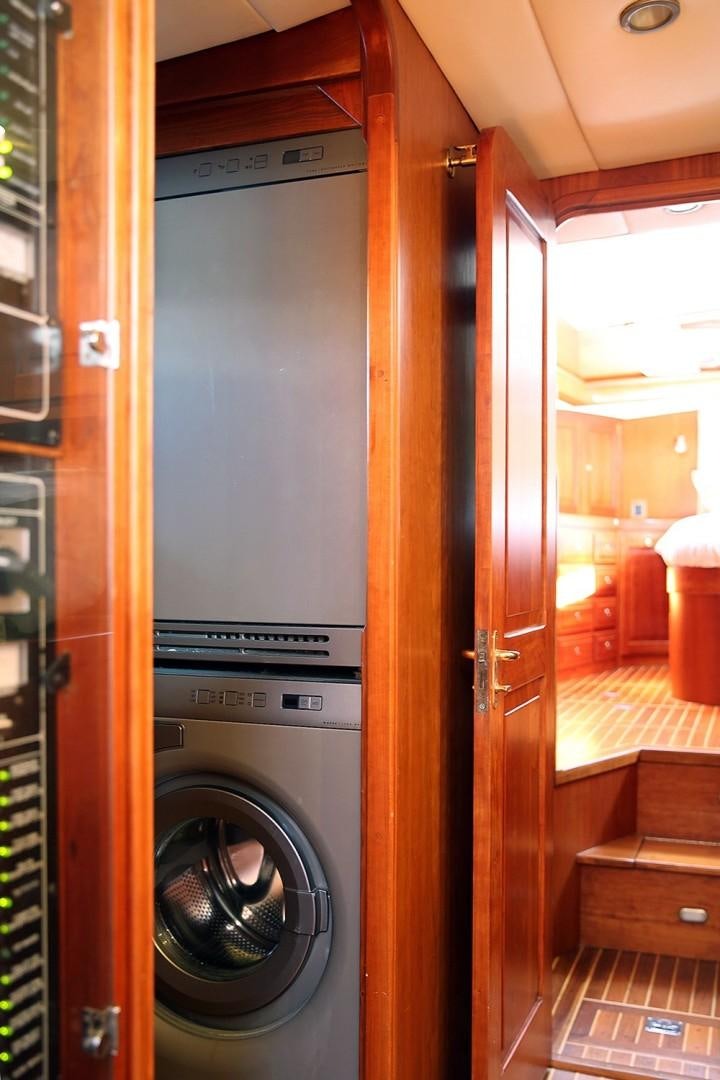 a washer and dryer in a room aboard DANCIN BARE V Yacht for Sale