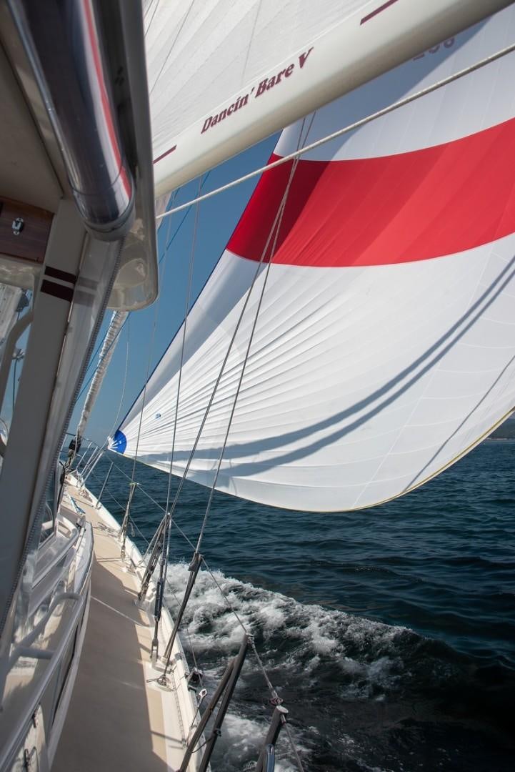 a sailboat on the water aboard DANCIN BARE V Yacht for Sale