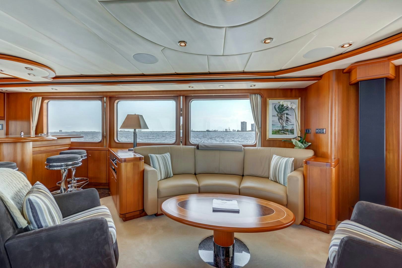 a living room with a couch and a coffee table aboard GUSTO Yacht for Sale