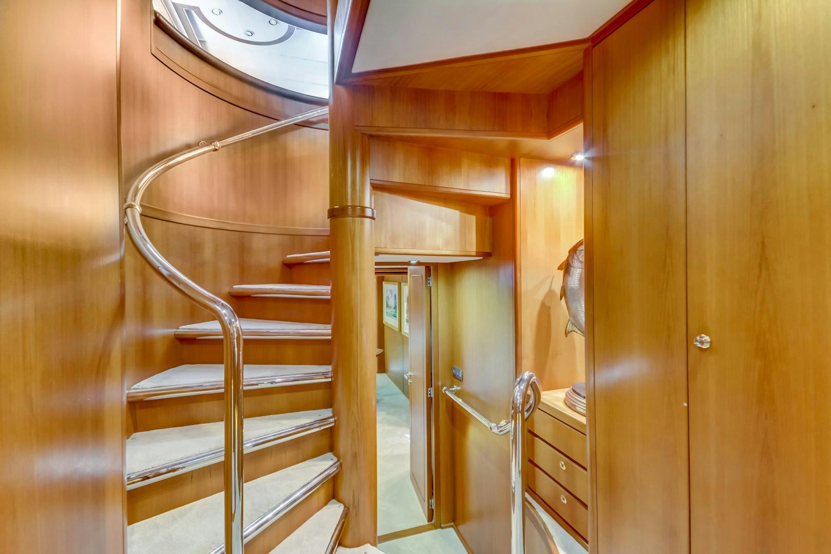 a wooden staircase in a house aboard GUSTO Yacht for Sale