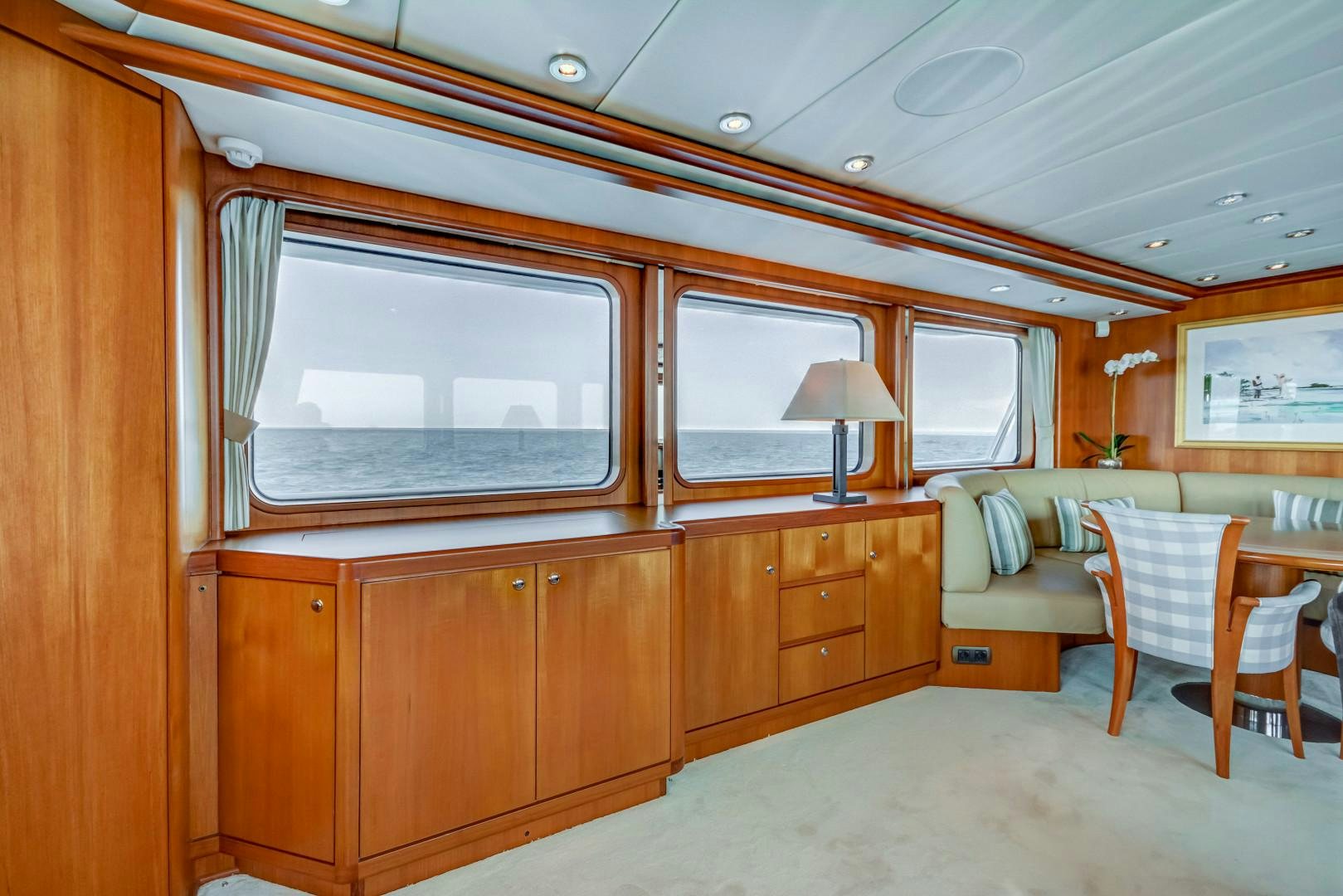 a room with a bed and a couch aboard GUSTO Yacht for Sale