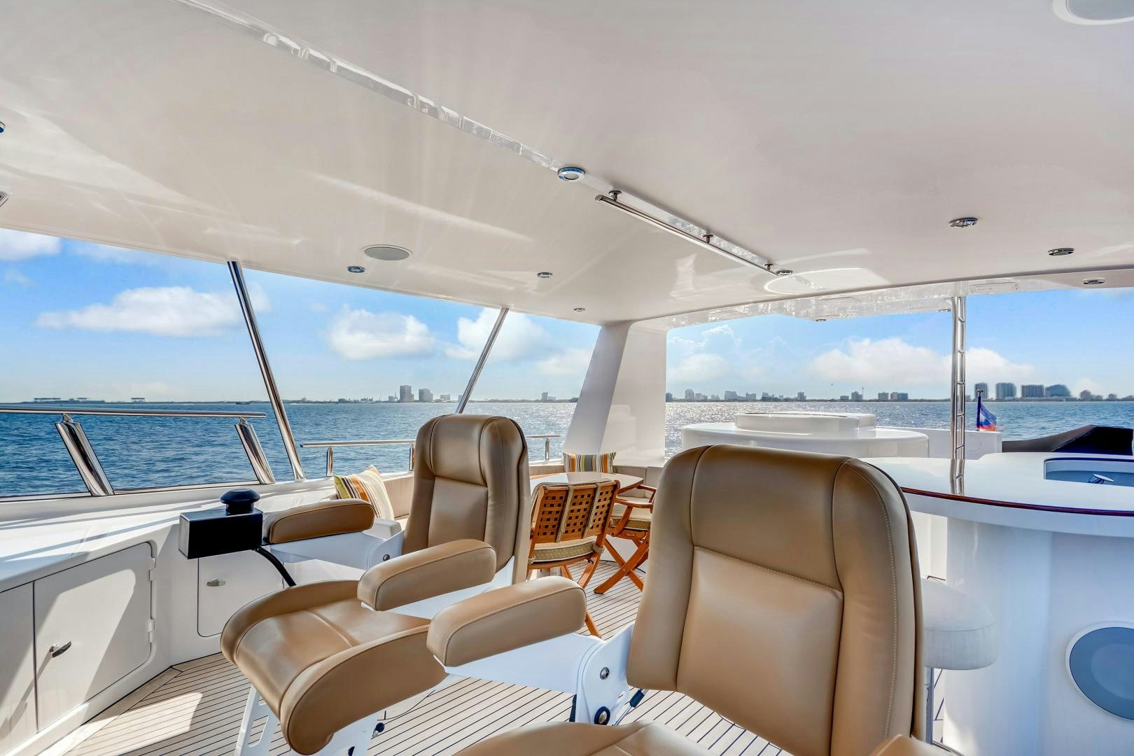 a boat with chairs and tables on it aboard GUSTO Yacht for Sale