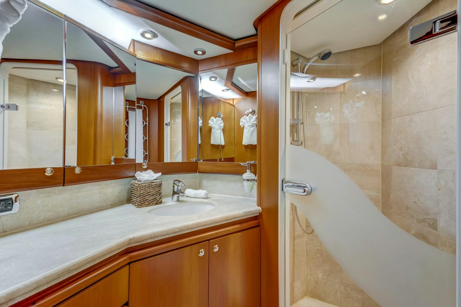 a bathroom with a large mirror aboard GUSTO Yacht for Sale