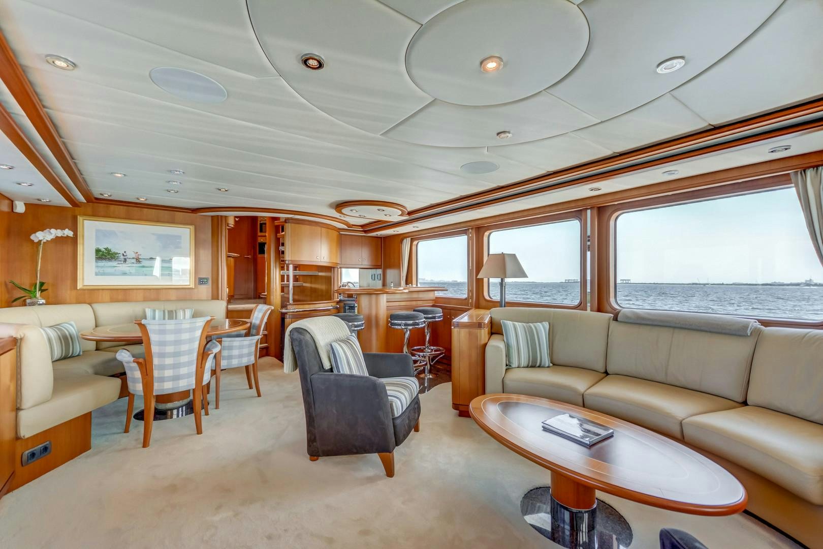 a living room with a couch and a table aboard GUSTO Yacht for Sale