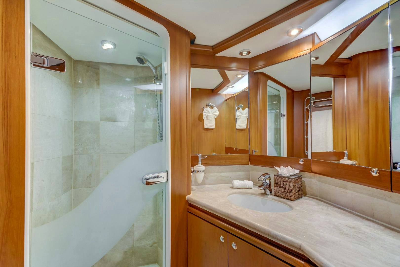 a bathroom with a large mirror aboard GUSTO Yacht for Sale