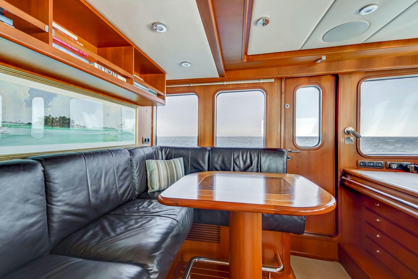 a train with a table and chairs aboard GUSTO Yacht for Sale