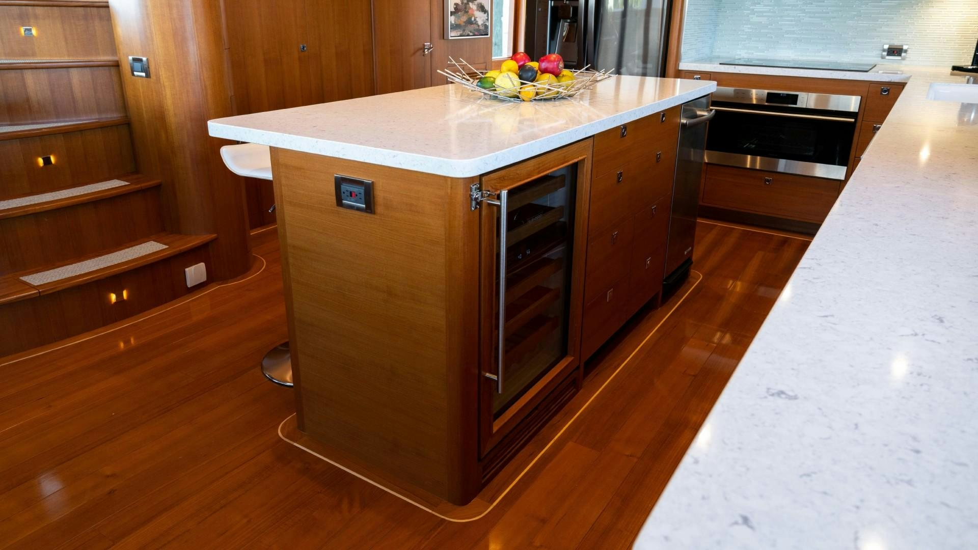 a kitchen with a large island aboard BLUE CHIP Yacht for Sale