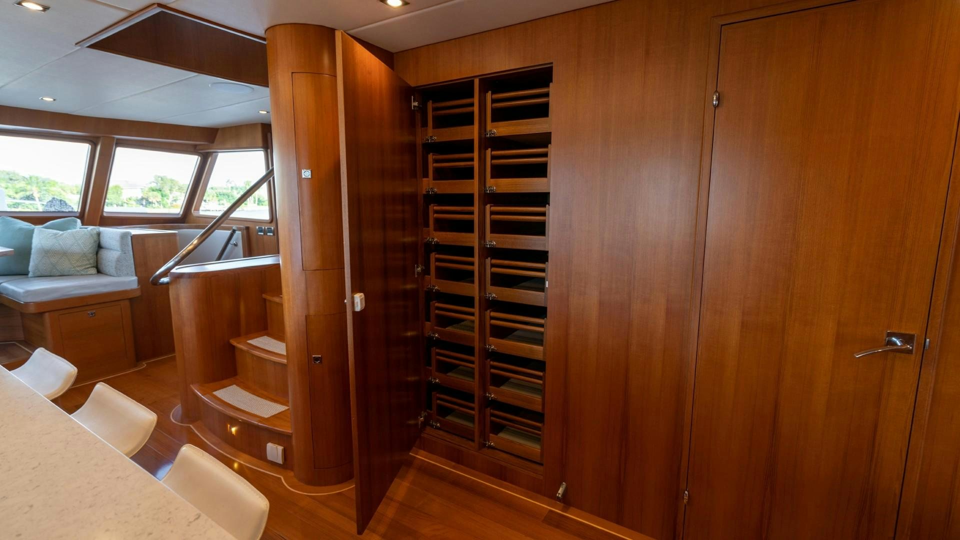 a room with wooden cabinets aboard BLUE CHIP Yacht for Sale