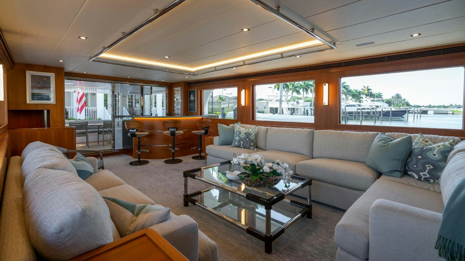 a living room with a large window aboard BLUE CHIP Yacht for Sale