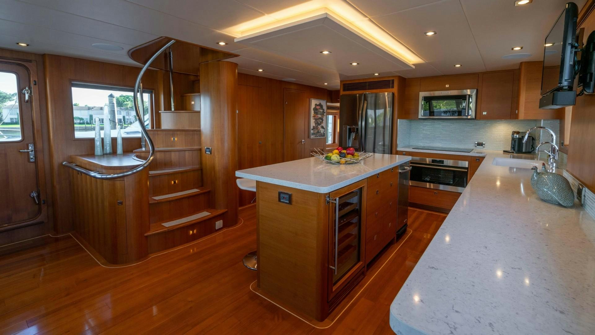 a kitchen with a large island aboard BLUE CHIP Yacht for Sale