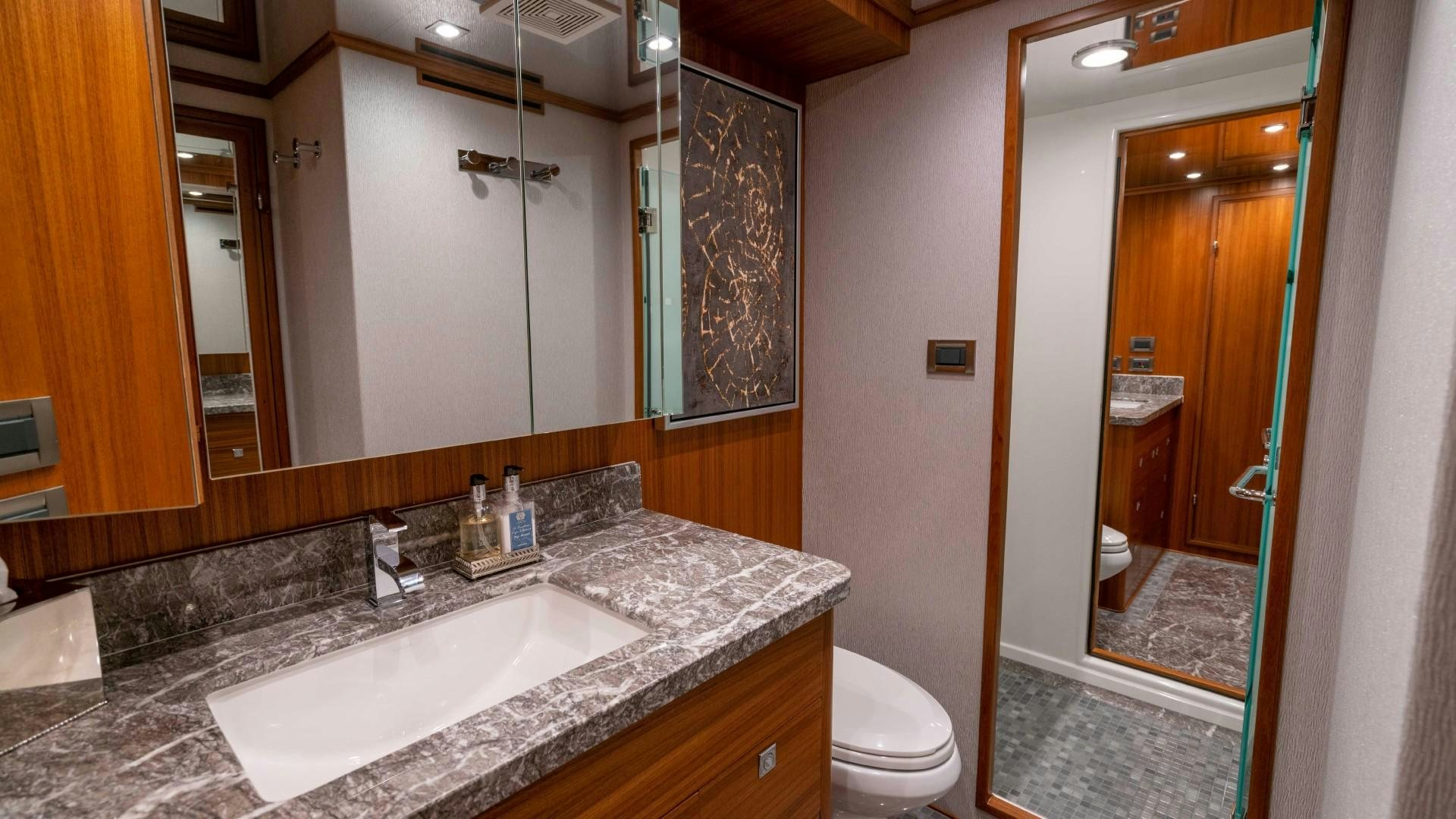 a bathroom with a marble counter top aboard BLUE CHIP Yacht for Sale