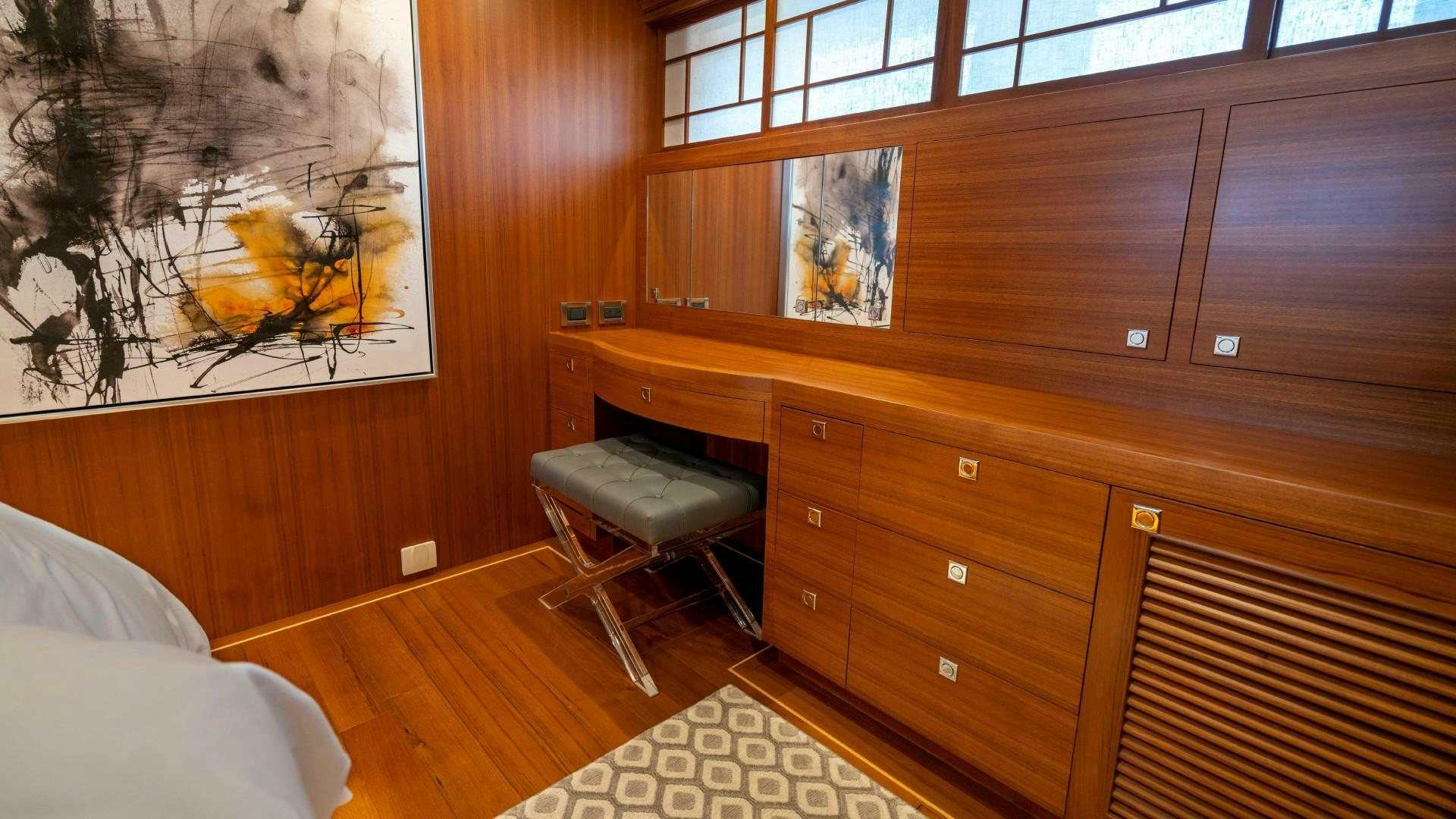 a room with a desk and a bed aboard BLUE CHIP Yacht for Sale