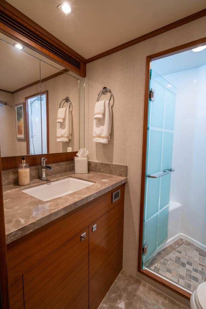 a bathroom with a sink and a shower aboard BLUE CHIP Yacht for Sale
