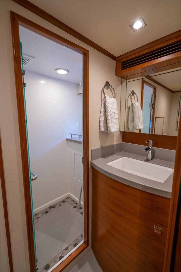 a bathroom with a sink and a shower aboard BLUE CHIP Yacht for Sale