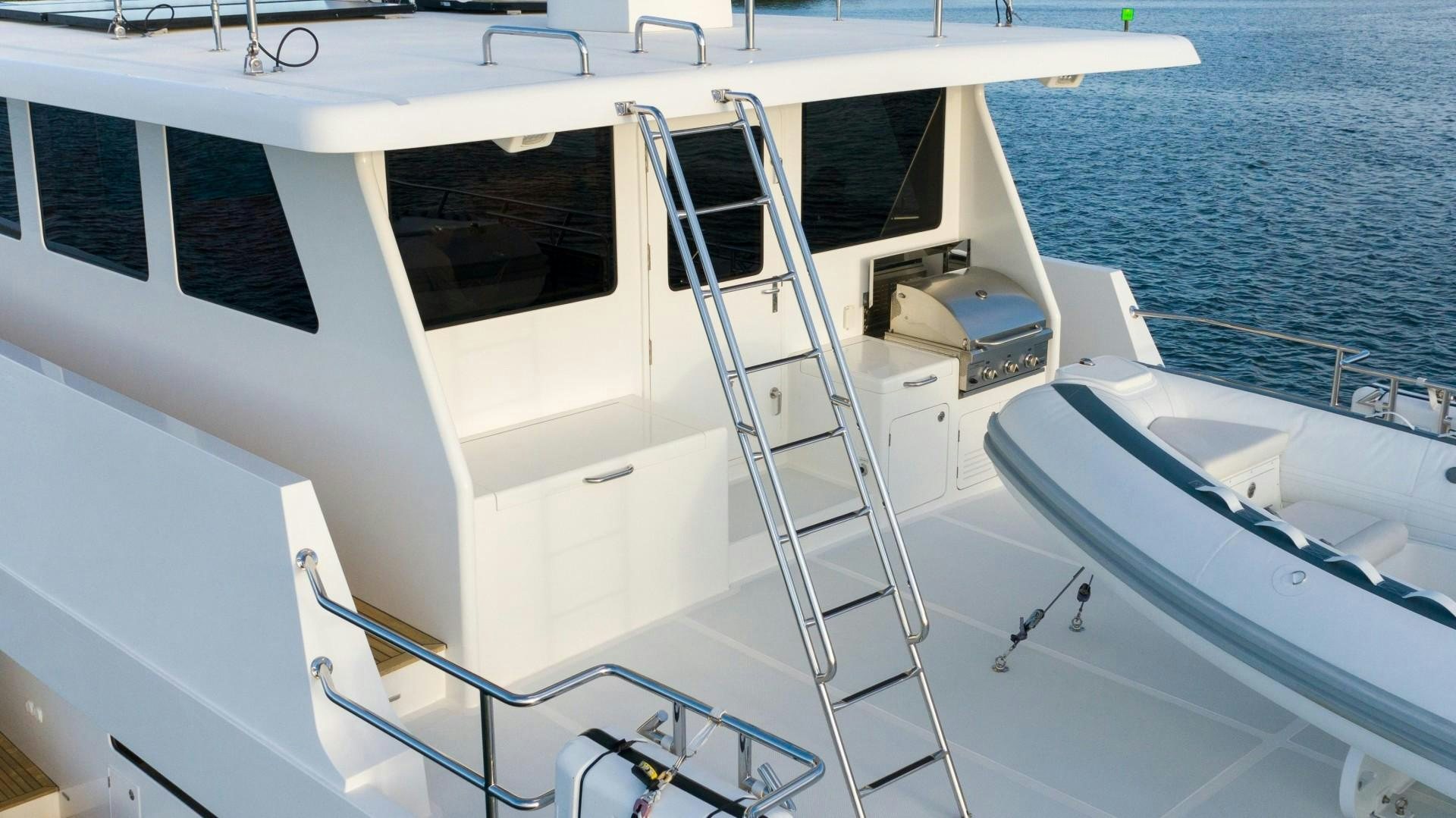 a white boat on the water aboard BLUE CHIP Yacht for Sale