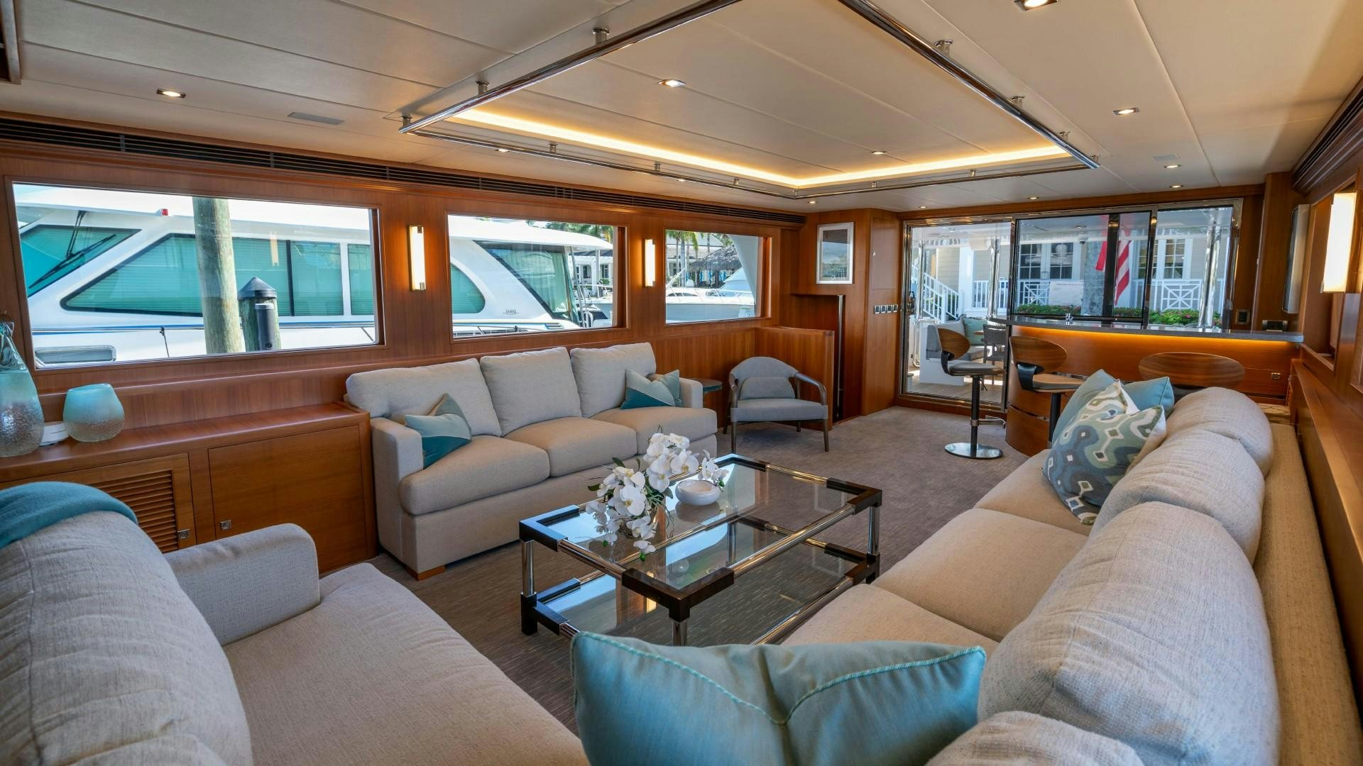a living room with a large window aboard BLUE CHIP Yacht for Sale