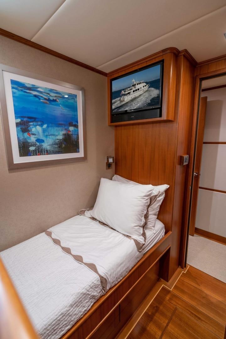 a bed in a room aboard BLUE CHIP Yacht for Sale