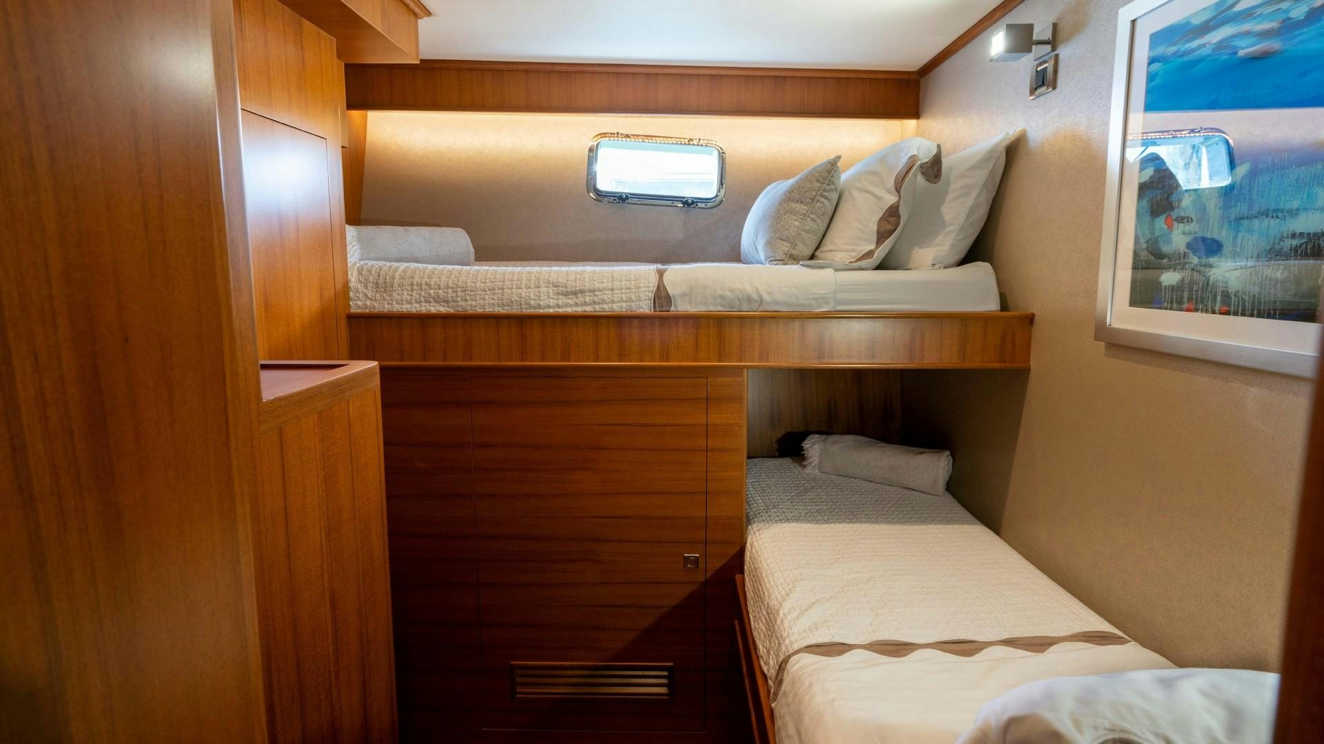 a bed with a mirror above it aboard BLUE CHIP Yacht for Sale