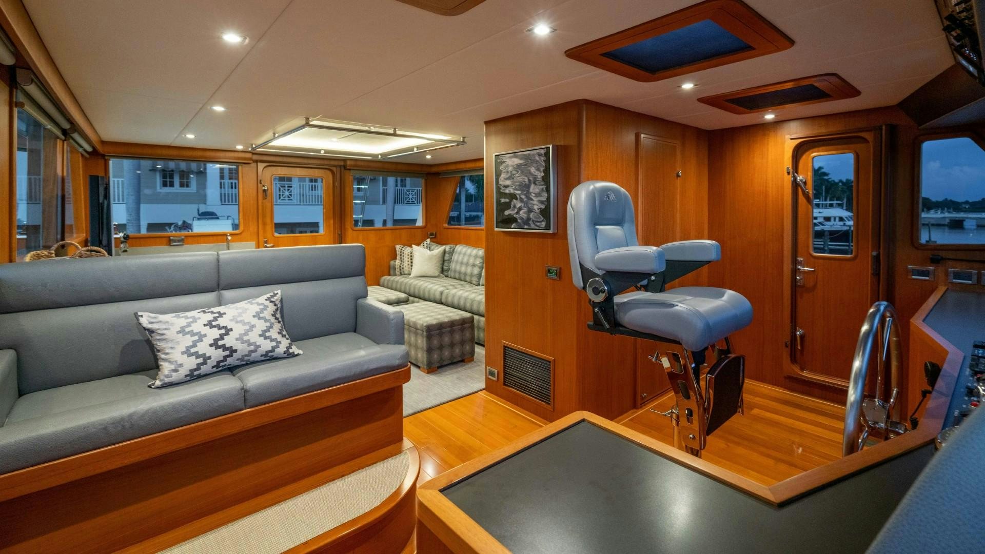 a living room with a couch and a table aboard BLUE CHIP Yacht for Sale
