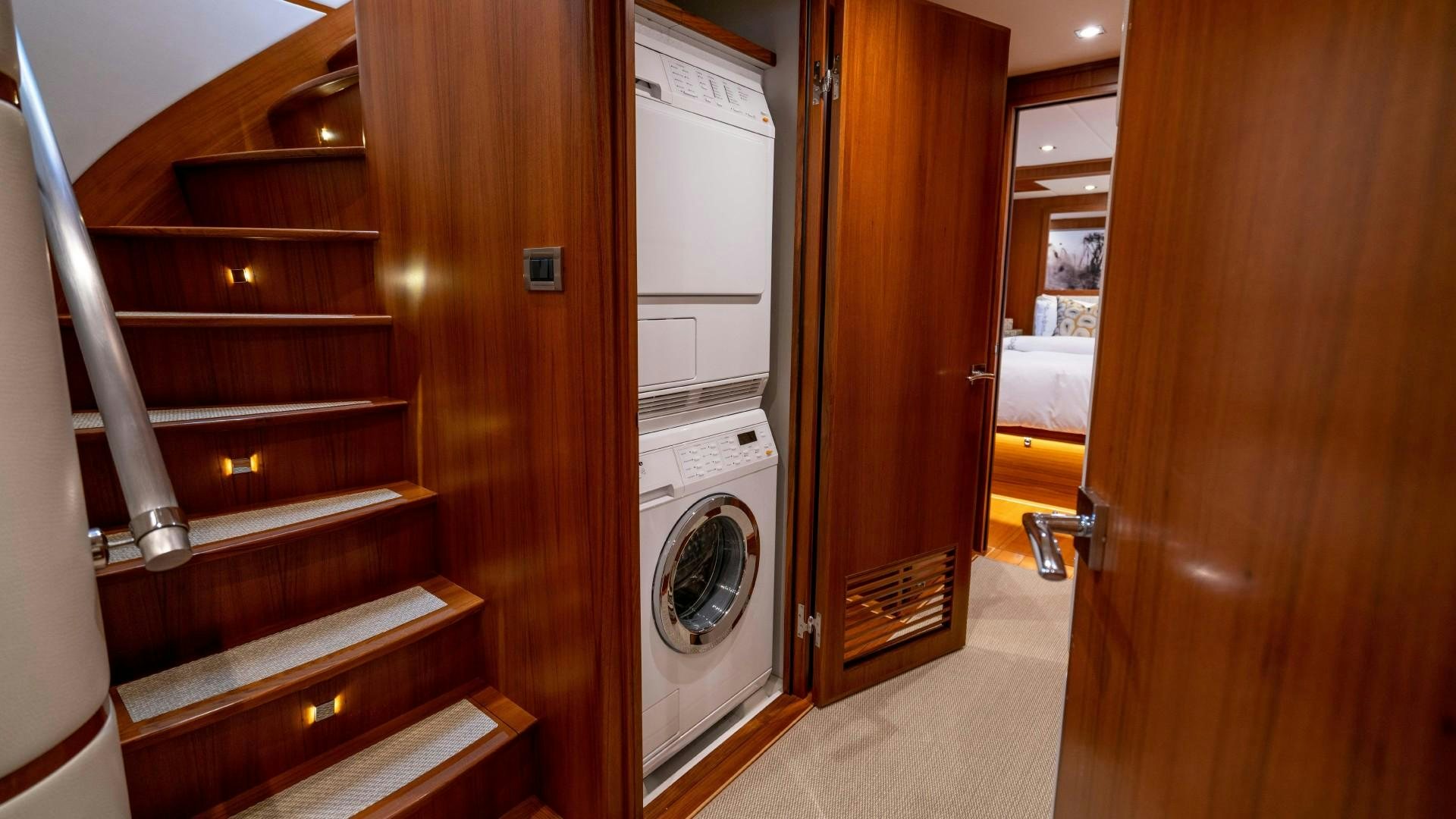a closet with a washer and dryer in it aboard BLUE CHIP Yacht for Sale