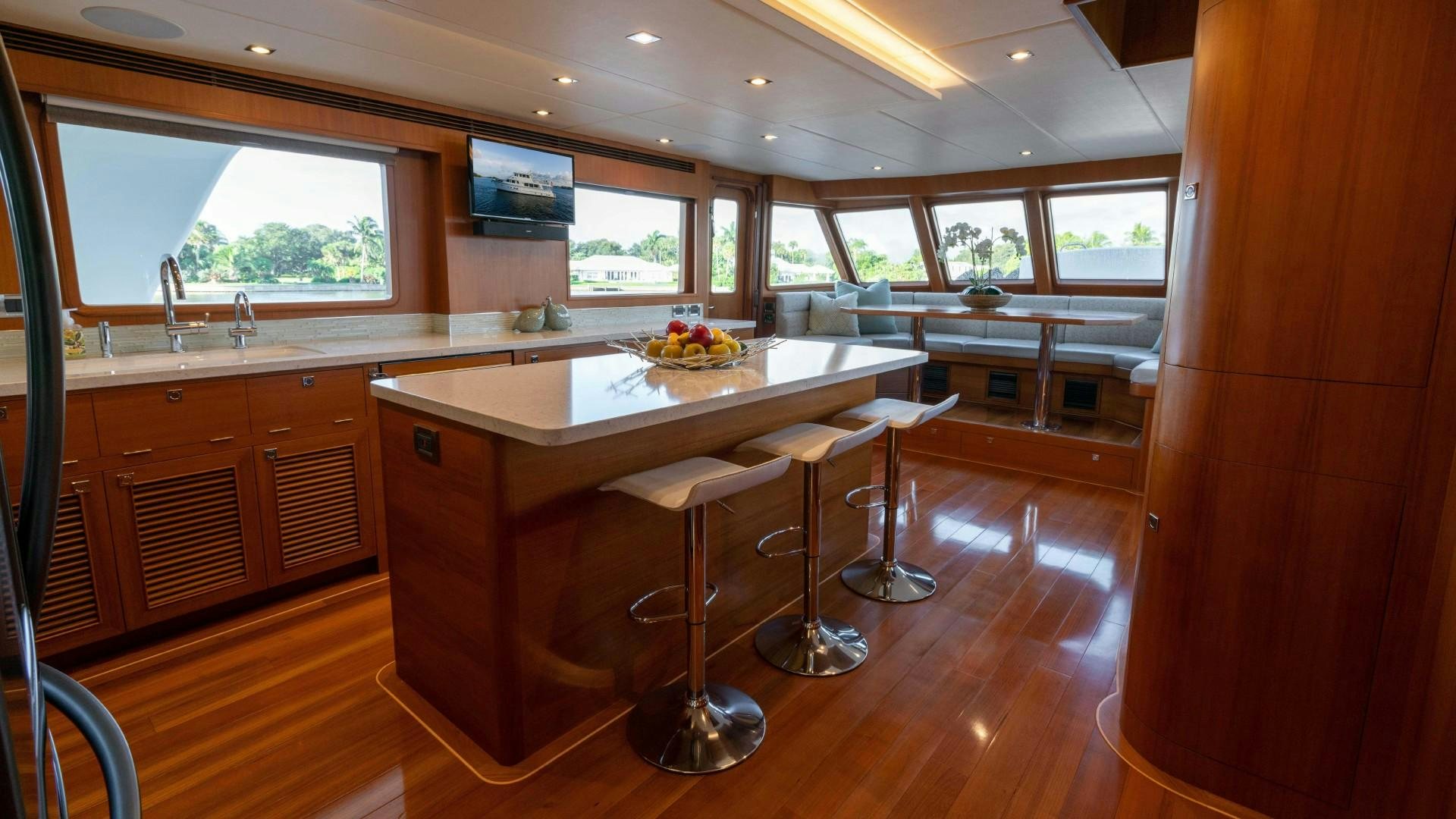 a kitchen with a table and chairs aboard BLUE CHIP Yacht for Sale