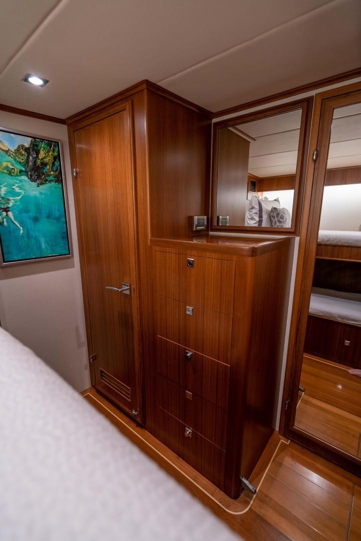 a room with wooden cabinets aboard BLUE CHIP Yacht for Sale