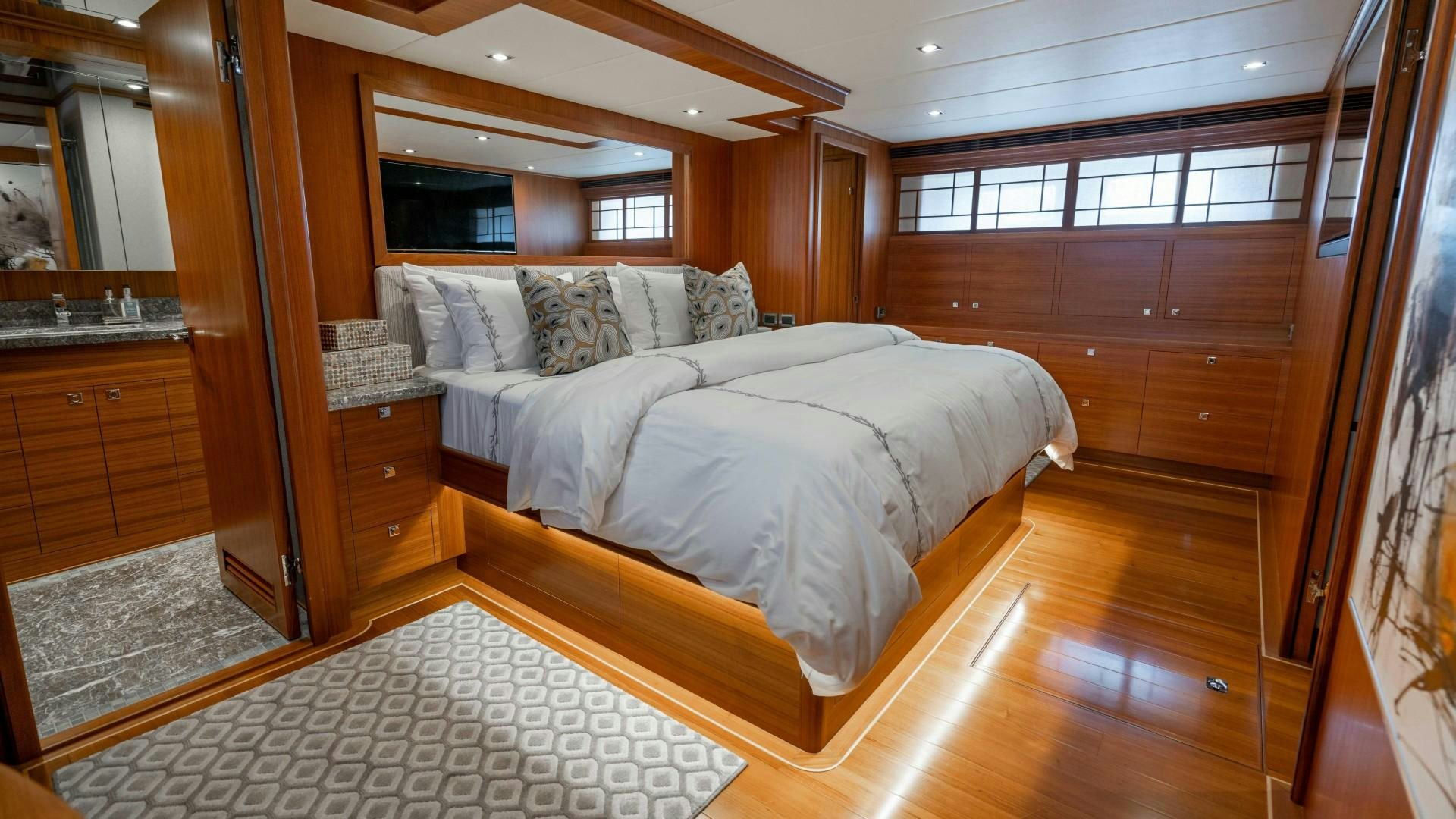 a room with a bed and a wood door aboard BLUE CHIP Yacht for Sale