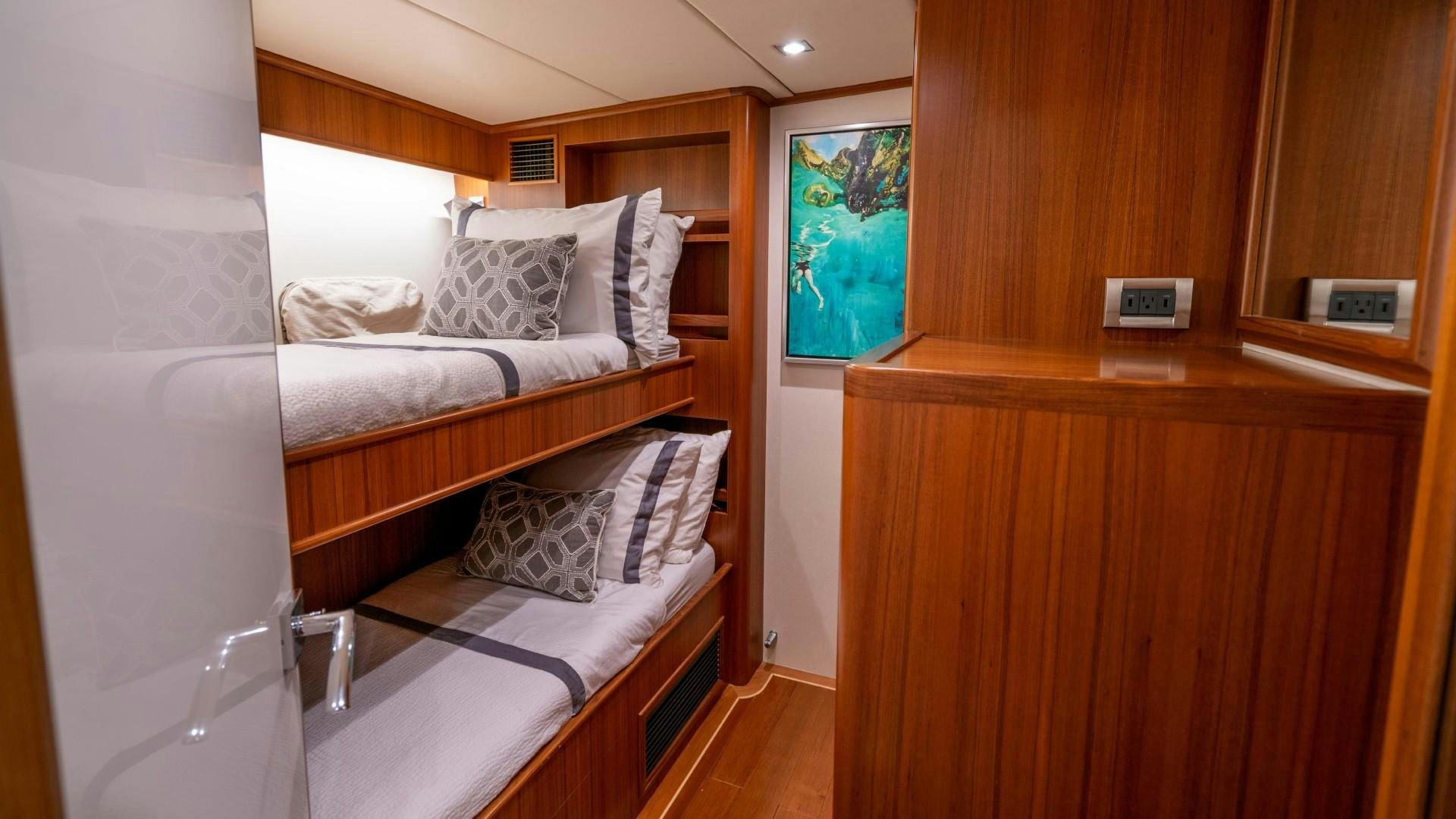 a room with a bed and a desk aboard BLUE CHIP Yacht for Sale