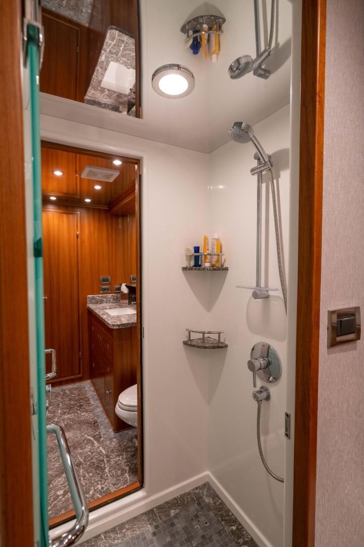 a bathroom with a shower and sink aboard BLUE CHIP Yacht for Sale