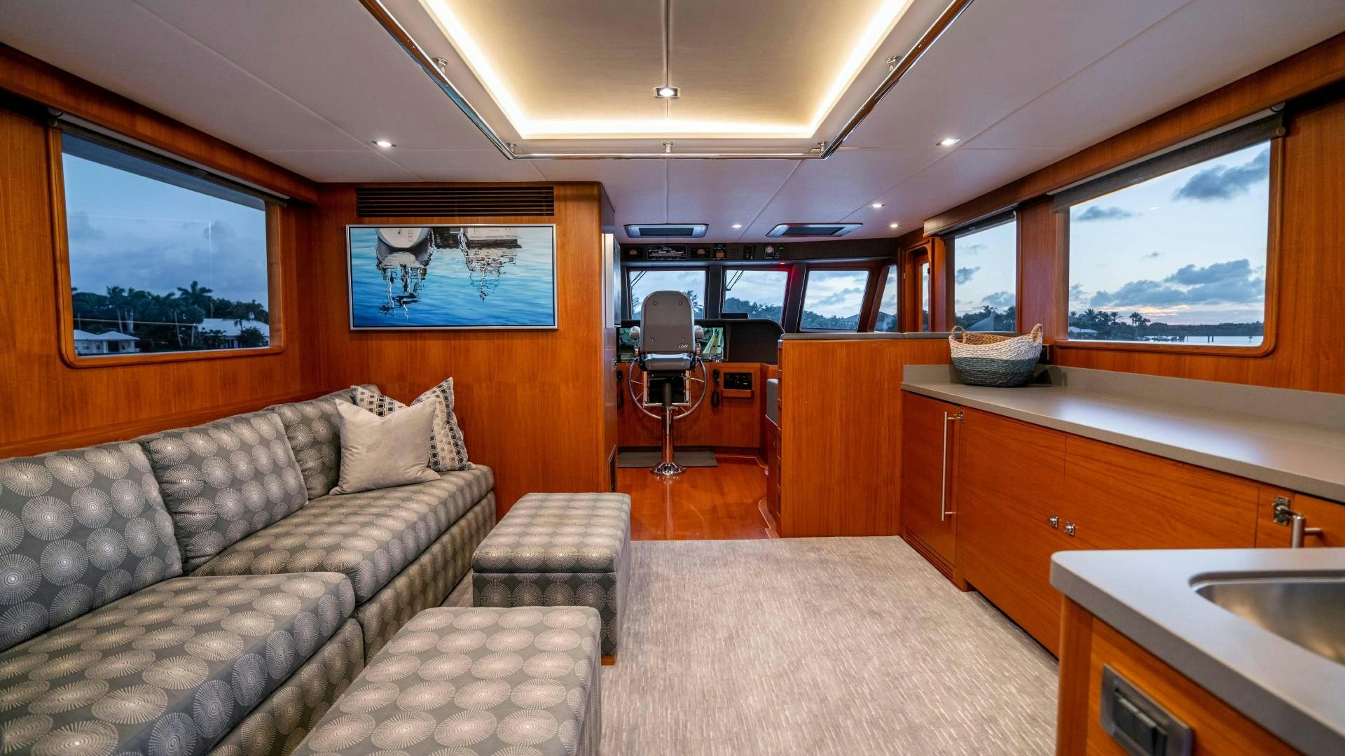 a living room with a couch and a table aboard BLUE CHIP Yacht for Sale