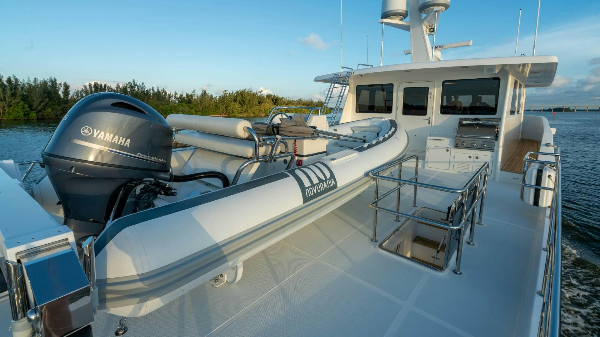 a boat with a black cap on the front aboard BLUE CHIP Yacht for Sale