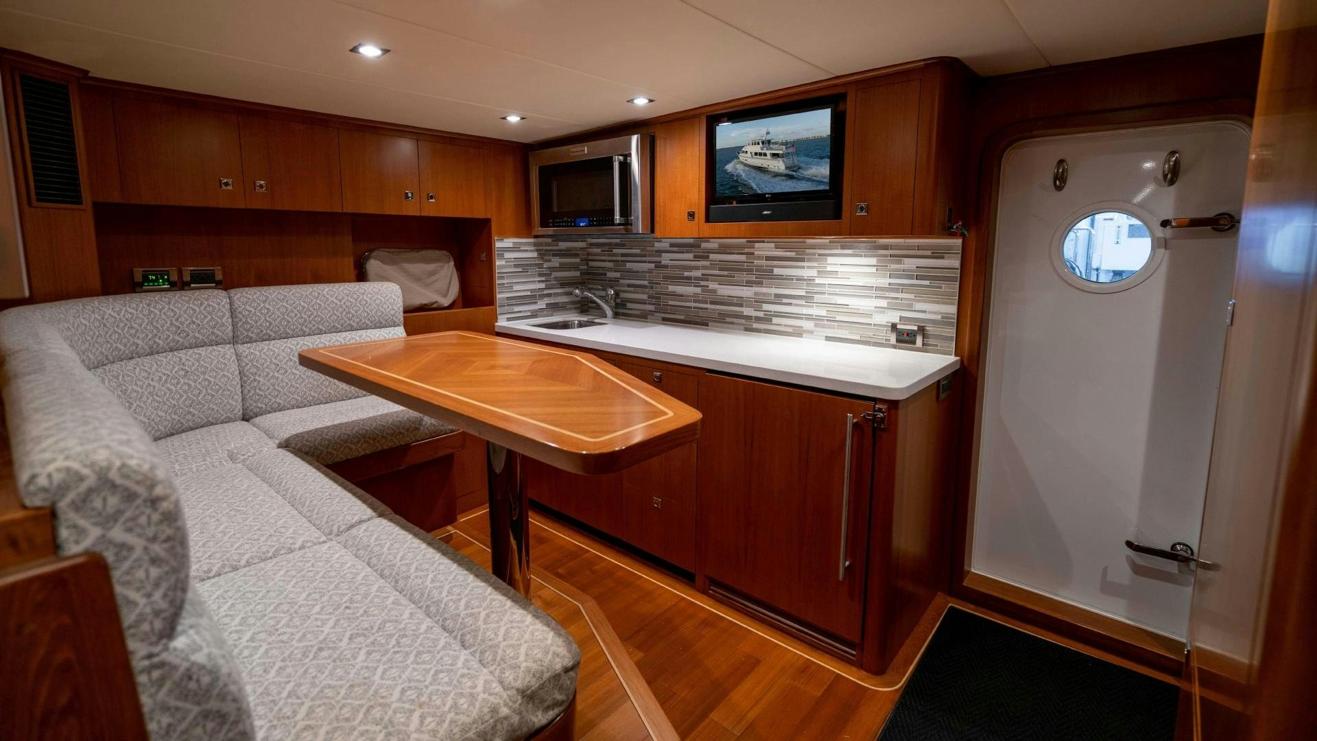 a room with a bed and a table aboard BLUE CHIP Yacht for Sale