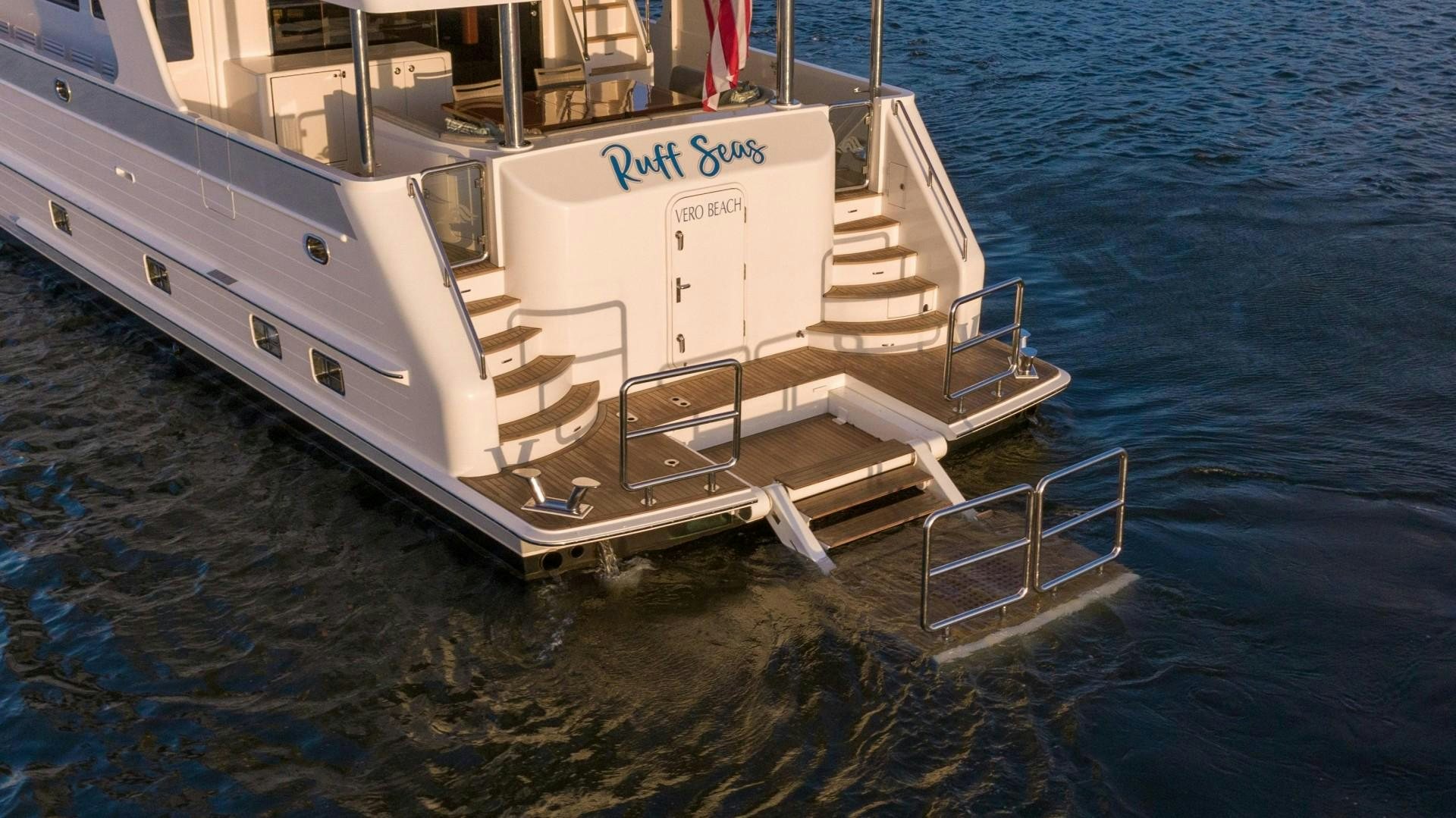 a white boat on the water aboard BLUE CHIP Yacht for Sale