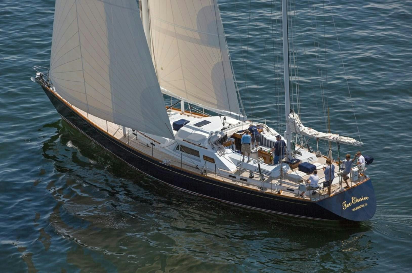 a large boat with people on it aboard DANCES WITH WOLVES Yacht for Sale