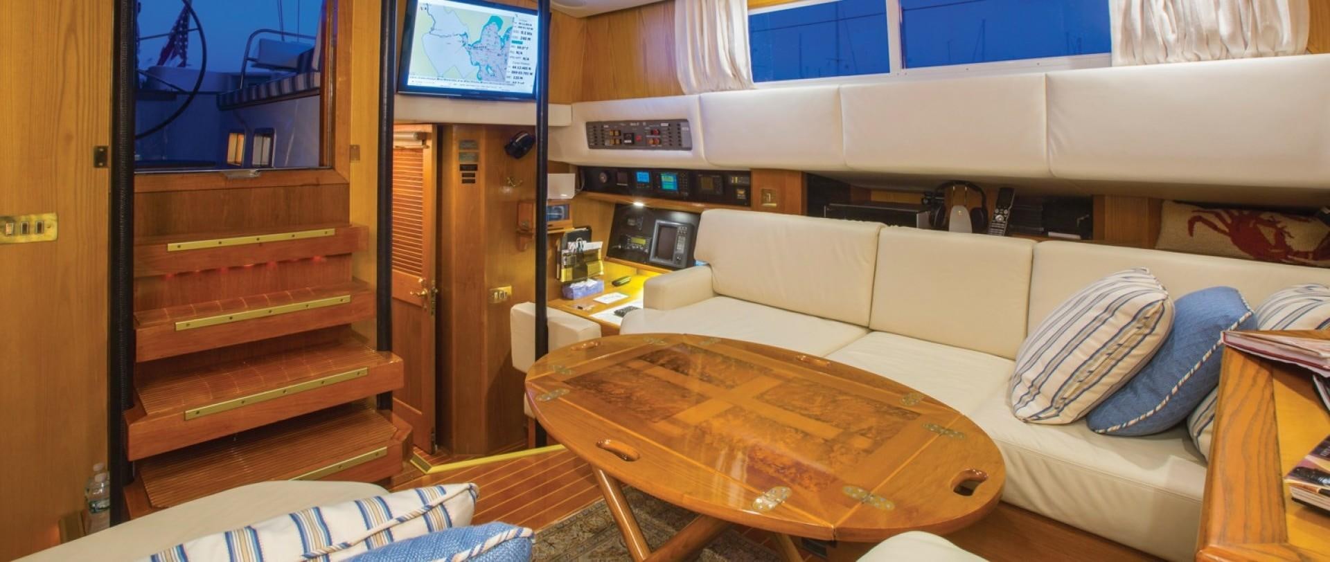 a living room with a couch and a tv aboard DANCES WITH WOLVES Yacht for Sale