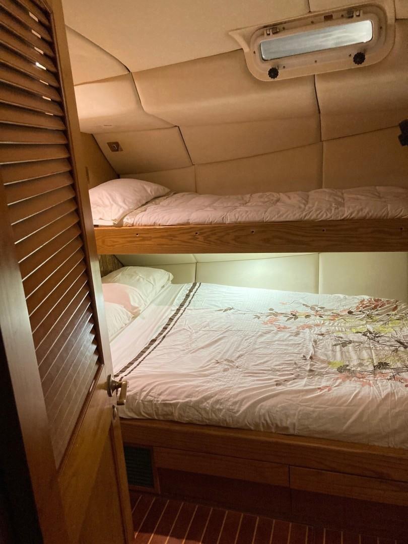 a couple of beds in a room aboard DANCES WITH WOLVES Yacht for Sale