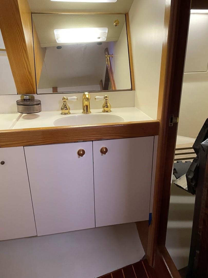 a bathroom with a large mirror aboard DANCES WITH WOLVES Yacht for Sale