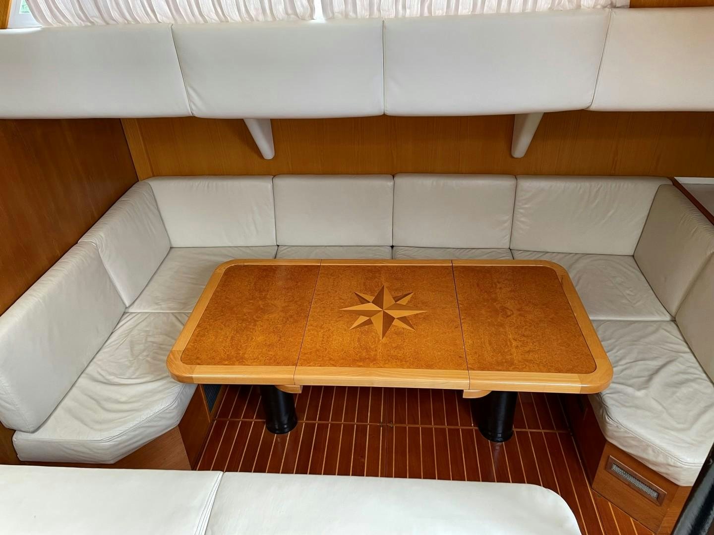 a table with a star on it aboard DANCES WITH WOLVES Yacht for Sale