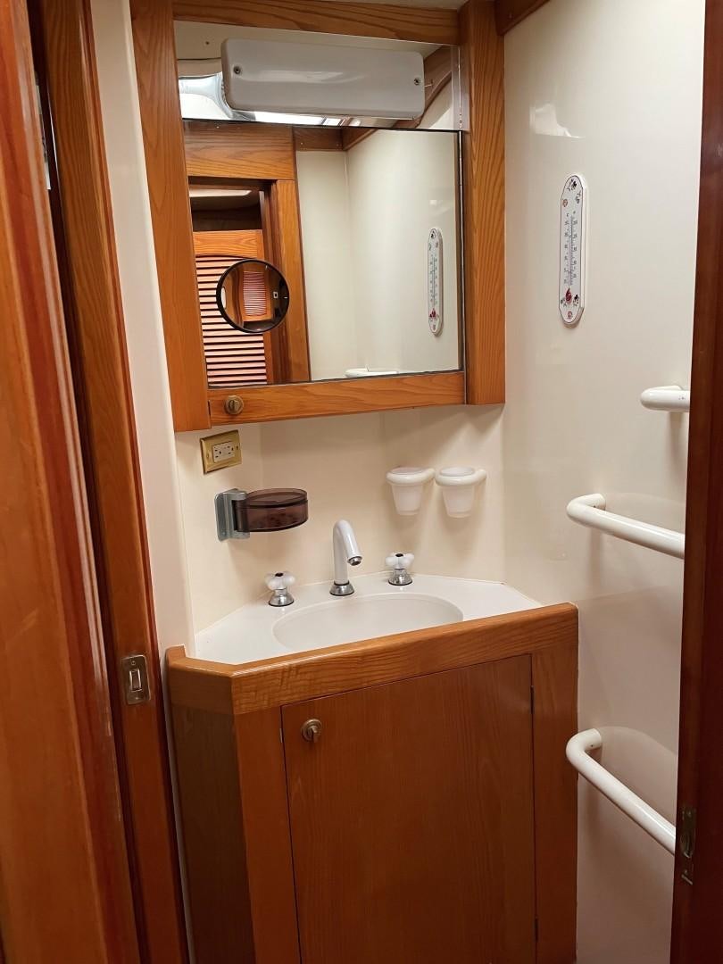 a bathroom with a mirror and a sink aboard DANCES WITH WOLVES Yacht for Sale