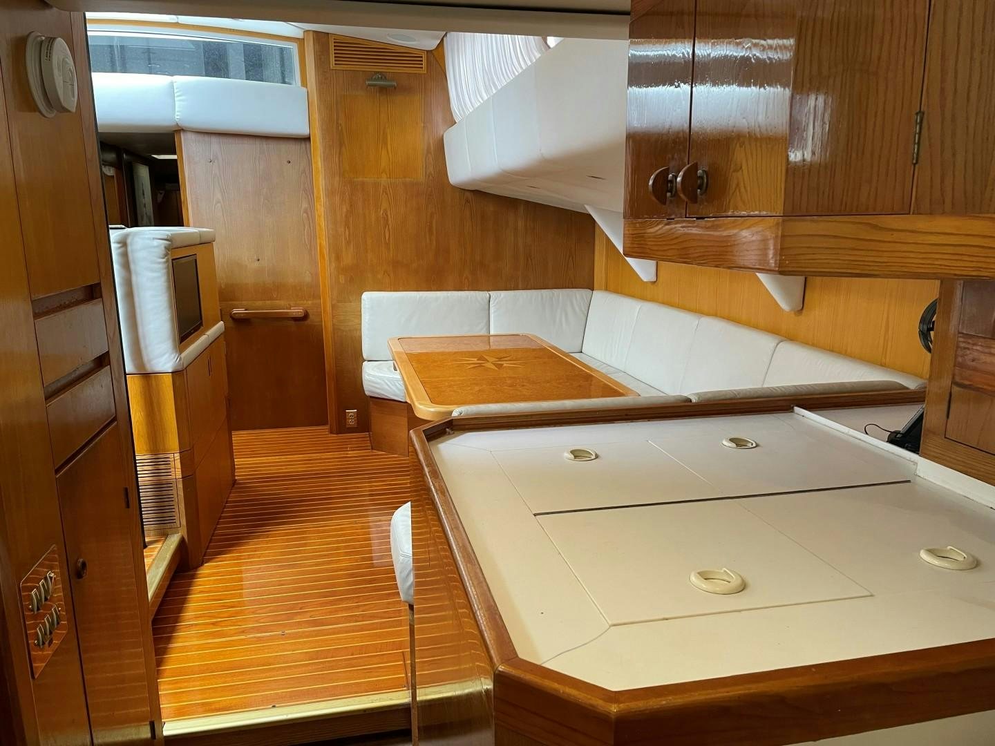 a kitchen with wooden cabinets aboard DANCES WITH WOLVES Yacht for Sale