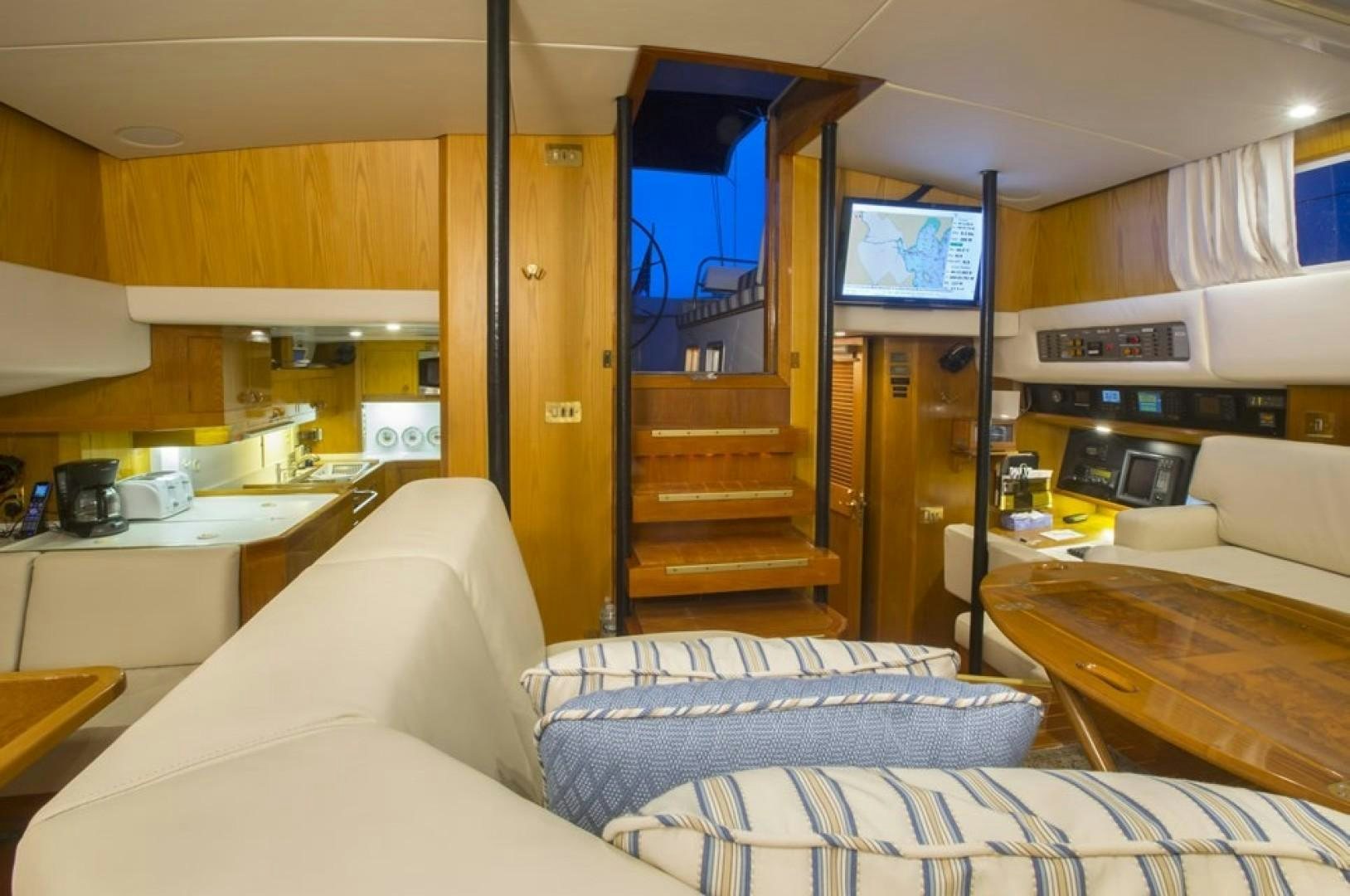 a room with a bed and a tv on the wall aboard DANCES WITH WOLVES Yacht for Sale