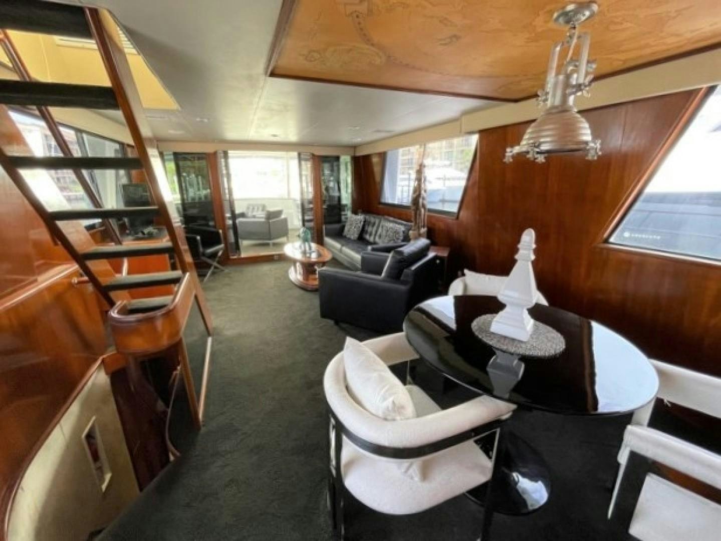 a room with a couch and a piano aboard MR. ED Yacht for Sale
